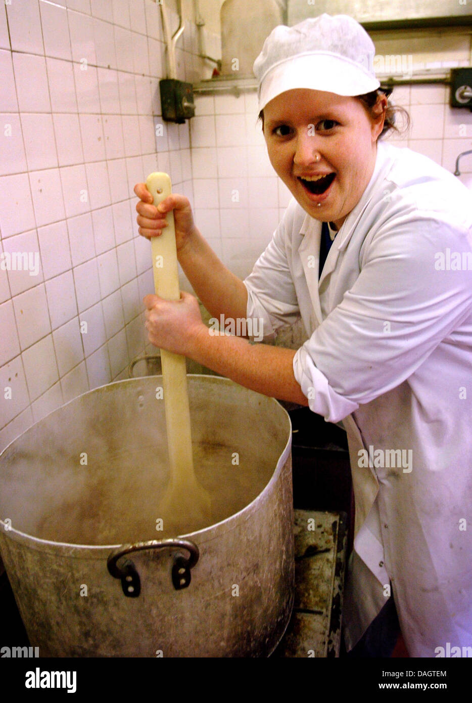 Cooking in a large pot, outside Stock Photo - Alamy