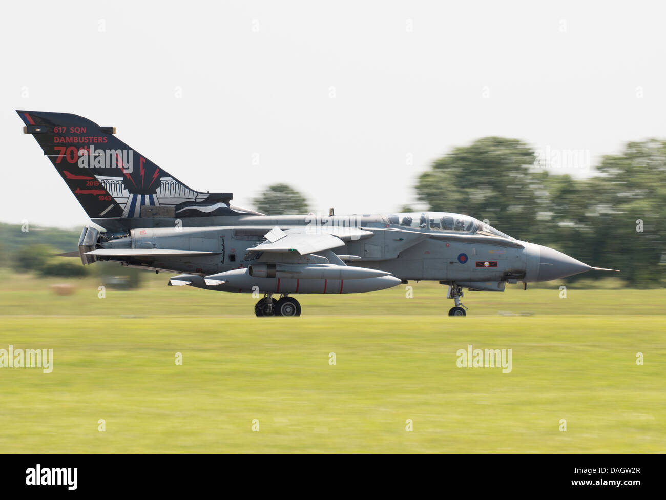 With Air Bakes and Trust Reversers deployed, Panavia Tornado GR4 ZA492 of RAF 617 Squadron slows after landing at RAF Waddington Stock Photo