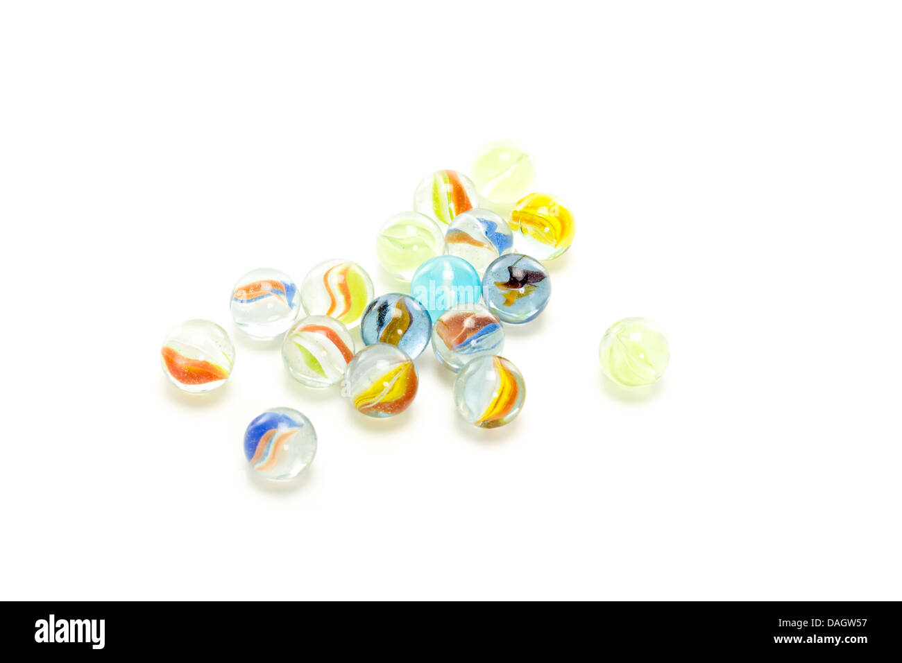 Some colourful marbles on white background Stock Photo - Alamy