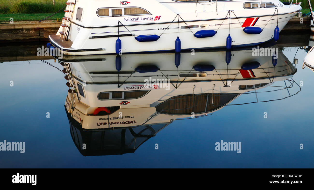 A reflection of a cruiser on the Norfolk Broads at Thurne, Norfolk, England, United Kingdom. Stock Photo