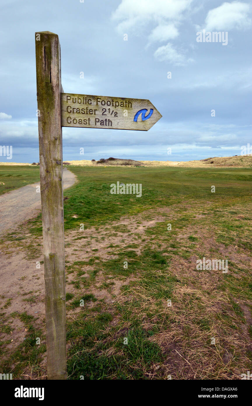 Wooden Signpost from to Craster on St Oswalds Way Long Distance Footpath Northumberland Coast Stock Photo