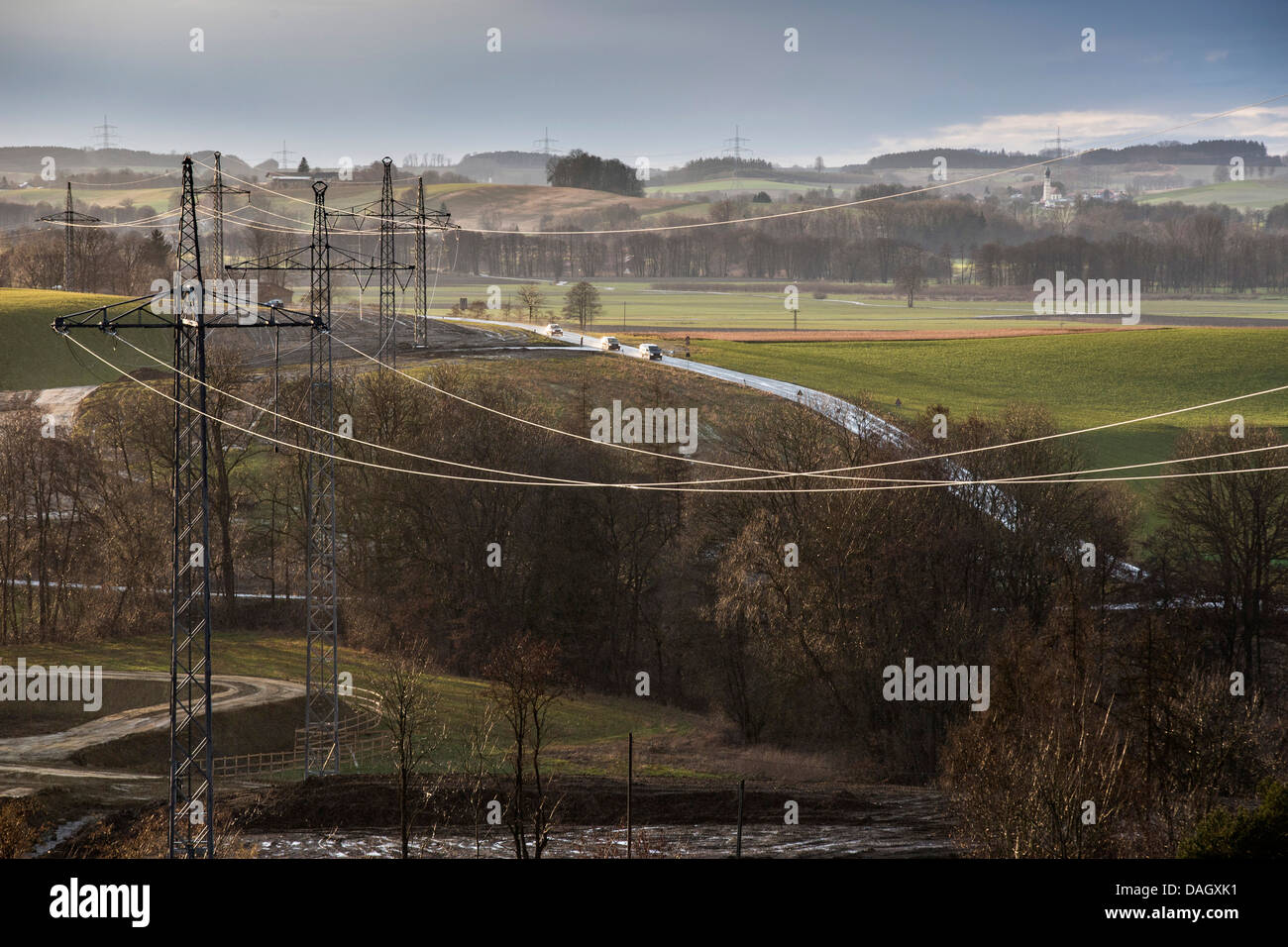 high-voltage lines in front rising storm over cultural landscape, Germany, Bavaria, Isental Stock Photo