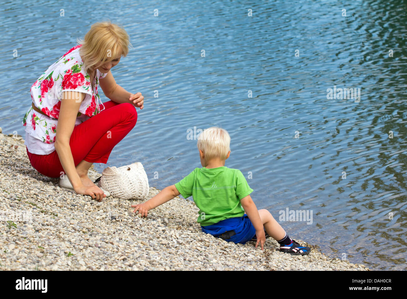 Mother and son by the water. Stock Photo