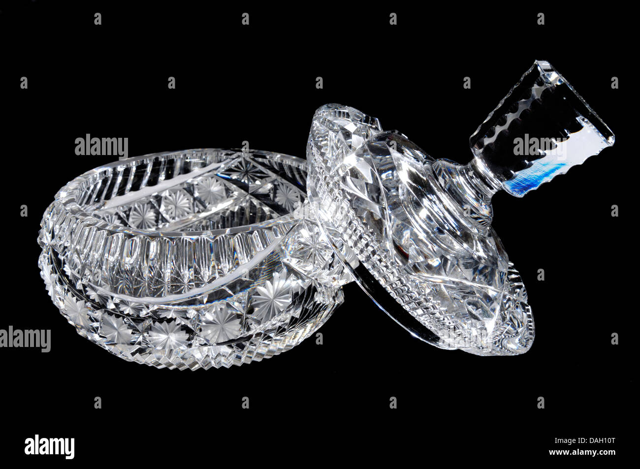 A brilliantly cut glass crystal dressing table box with the lid to one