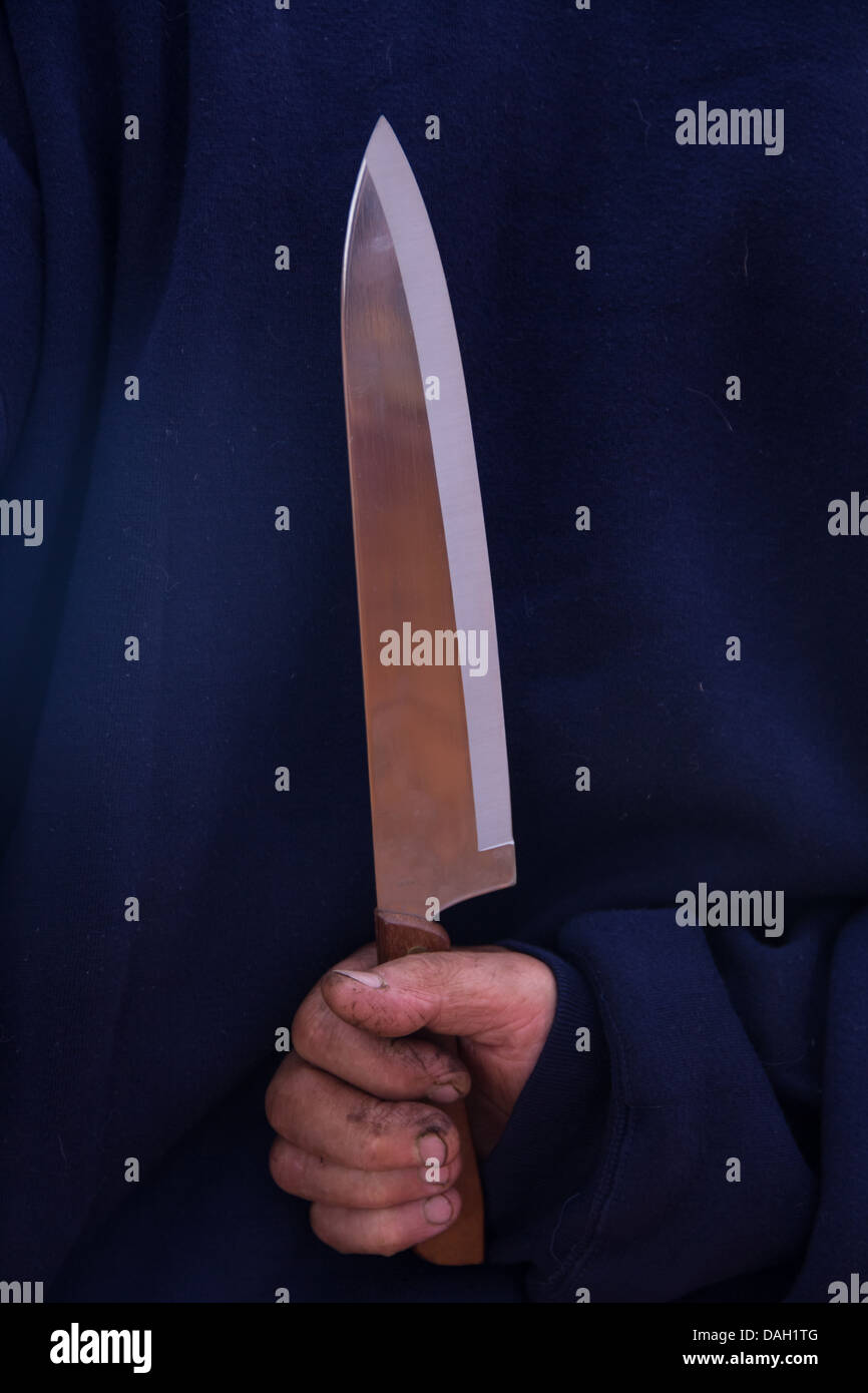 Hand holding stabbing knife hires stock photography and images Alamy