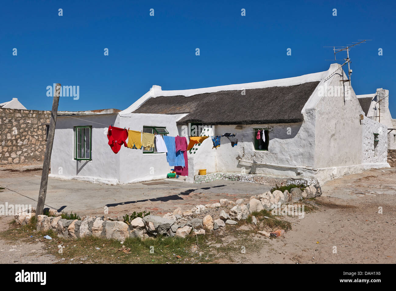 white washed reed thatched roof cottages in Kassiesbaai, Arniston, Cape Agulhas, Western Cape, South Africa Stock Photo