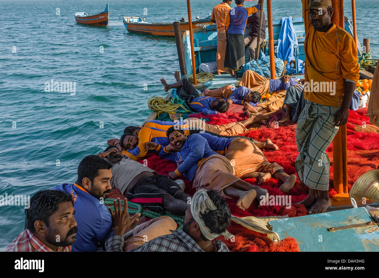 Fishermen take a break on the high seas off the Malabar Coast near Kannur, Kerala, India. Stock Photo