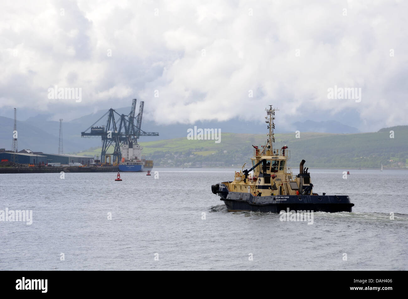 A tug boat heading down the river Clyde to the Clydeport in Greenock, Scotland. Stock Photo