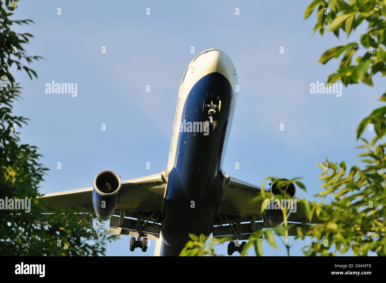 A large low-flying aircraft seconds from landing at Glasgow international airport, Scotland, UK Stock Photo