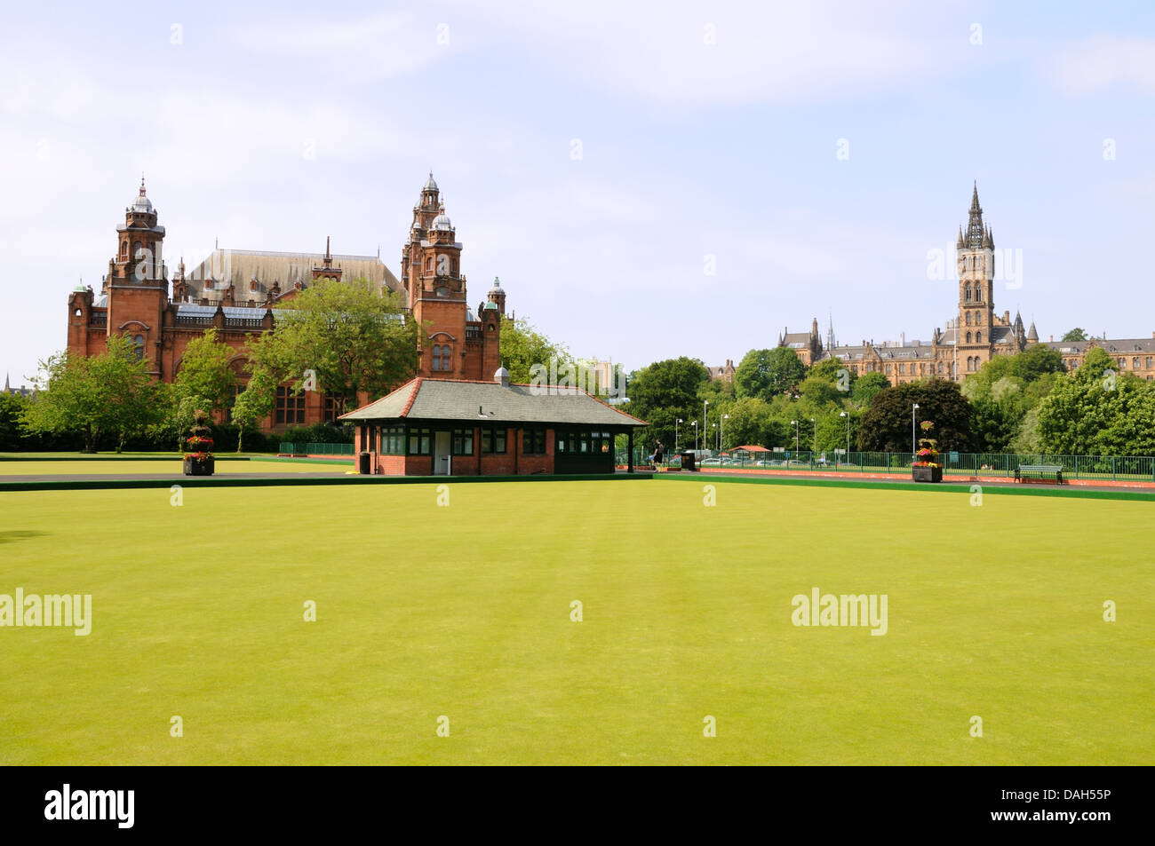 Newly laid bowling greens with the Glasgow Art Gallery and University Stock Photo