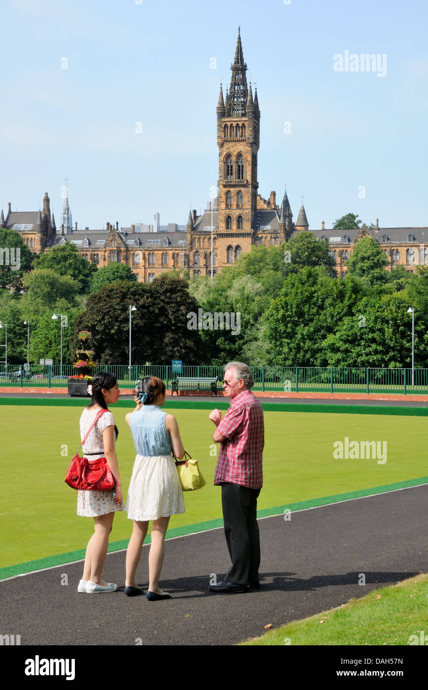 Two students ask for directions as they tour the site of Glasgow's 2014 Commonwealth games bowls event. Stock Photo