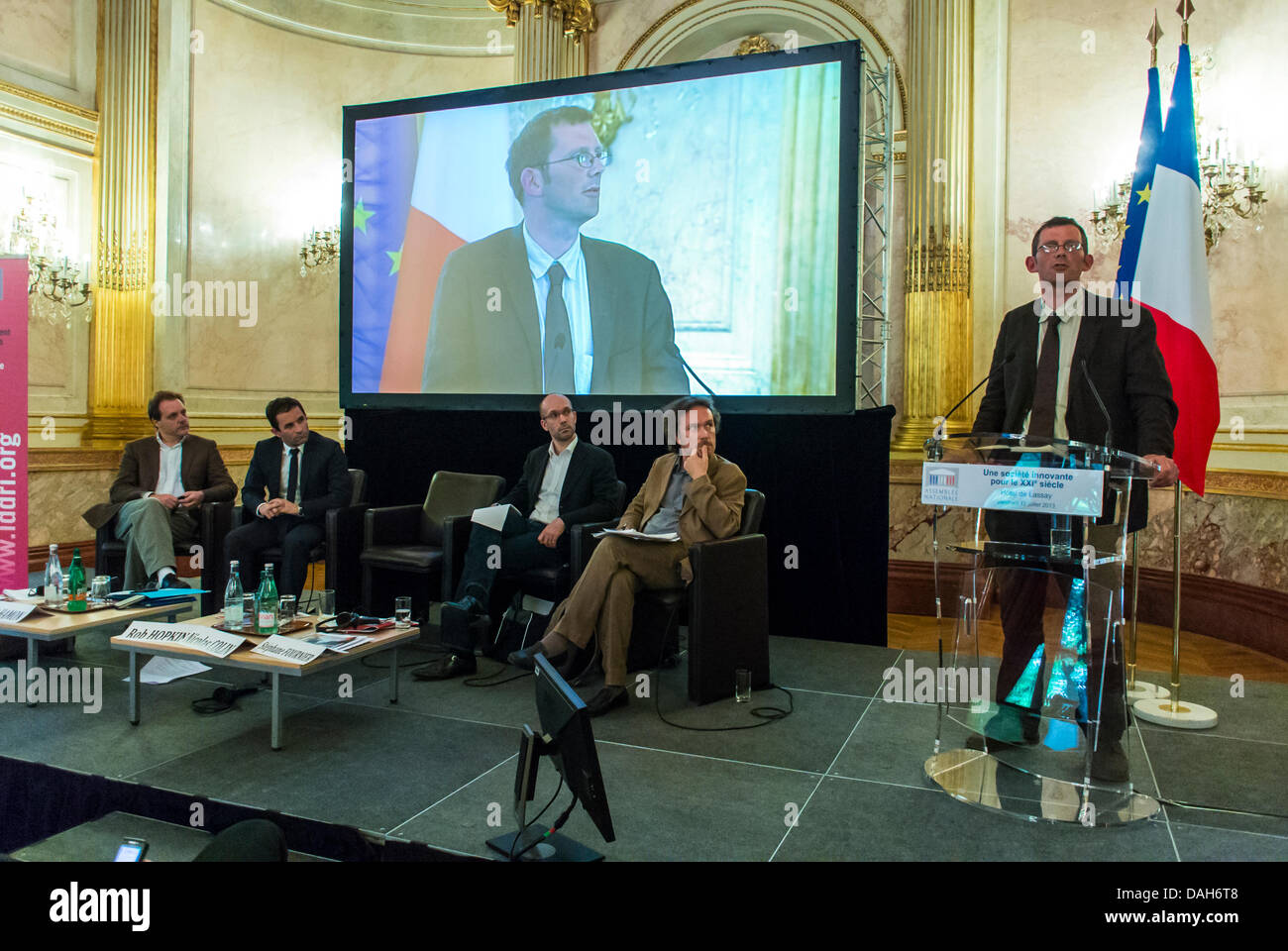 Paris, France. International Business Conference, The Innovative Society of the 21st century, 'Benoit Hamon'  (French Minister of Social Economy, Solidarity and Consummation) Giving presentation slides Speech to Audience, panel of speakers, speaker Podium Stock Photo