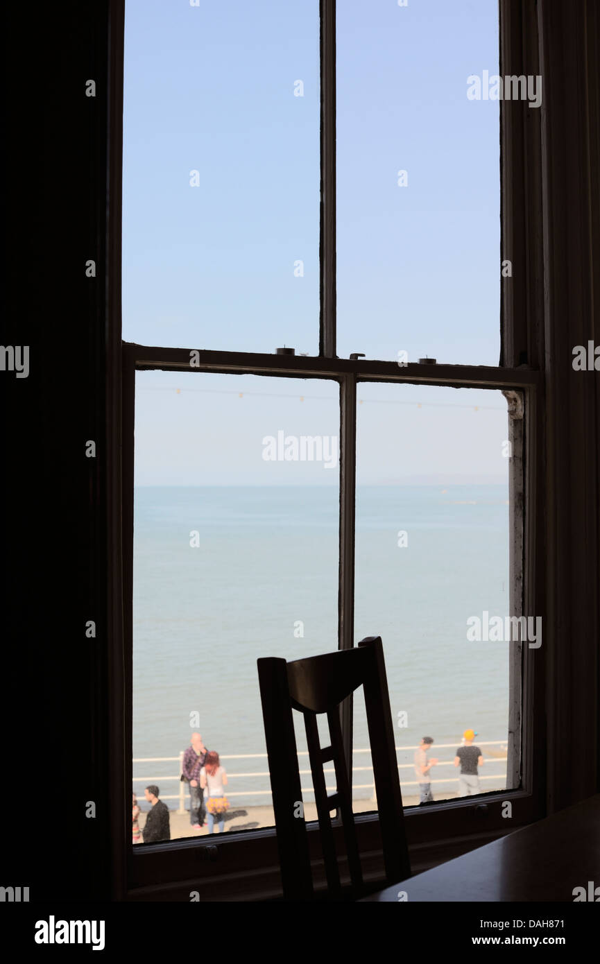 View from a restuarant, cafe window overlooking the promenade and sea, Aberystwyth, Wales, UK Stock Photo