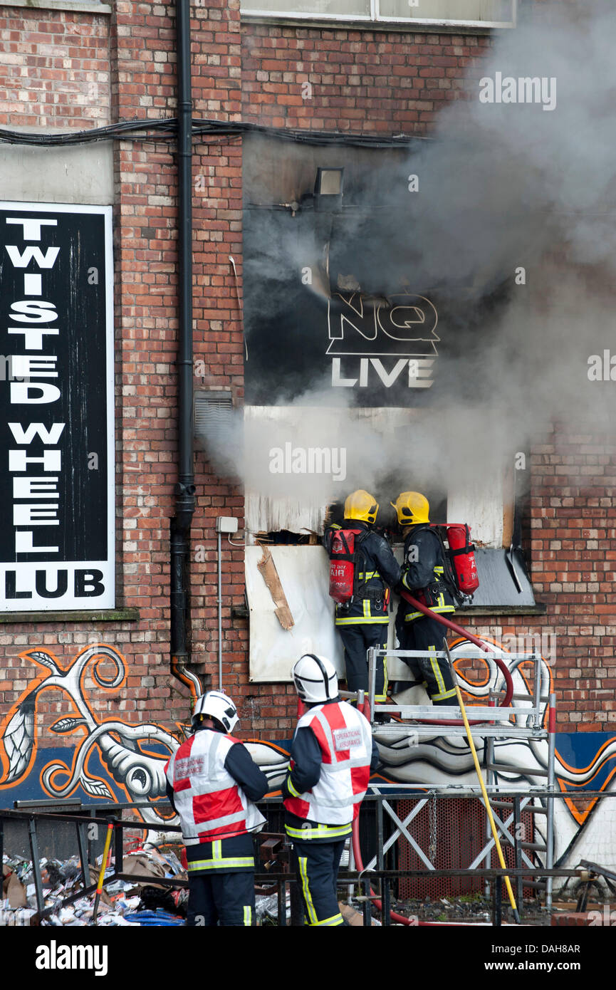Manchester, UK. 13th July, 2013. Firefighters tackle a blaze at Paul's ...