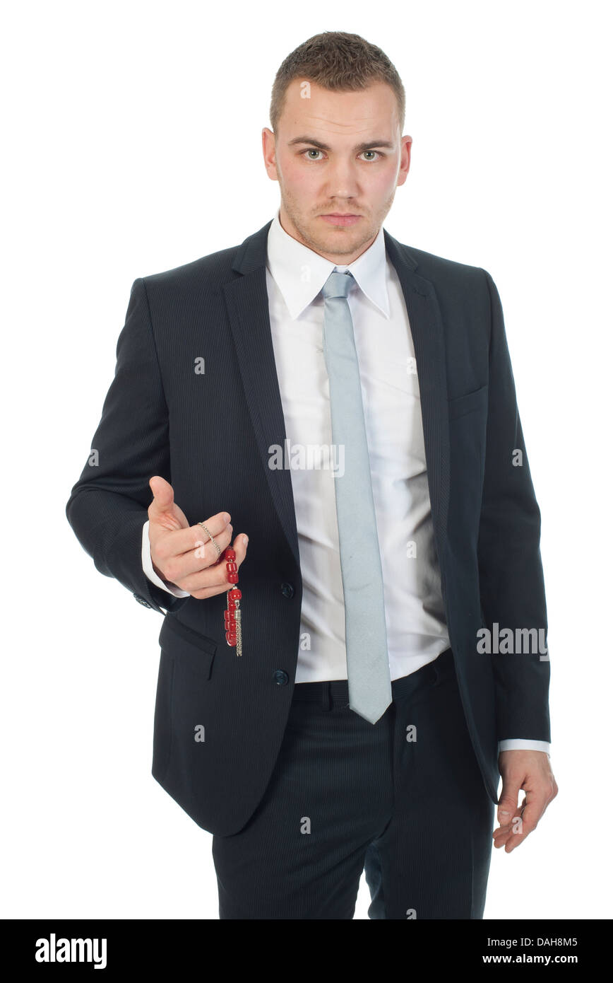 a businessman holding a Greek komboloi, an important part of the Greek culture Stock Photo