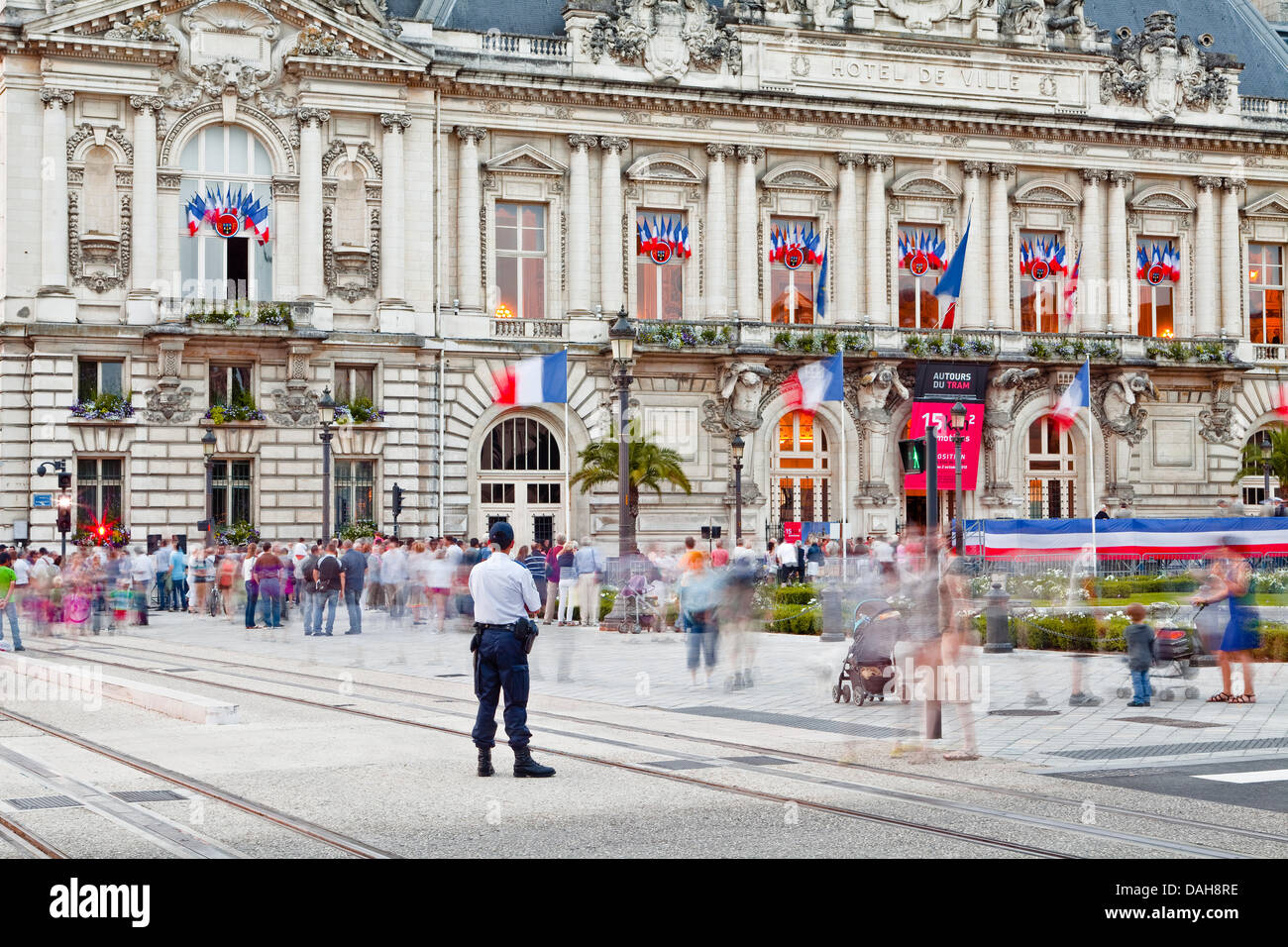 Tours, France. 13th July, 2013. A police officer watches over the people gathering in Tours for the Bastille Day celebrations on the 14th July in Tours, France, on Saturday July 13th, 2013 Credit:  Julian Elliott/Alamy Live News Stock Photo