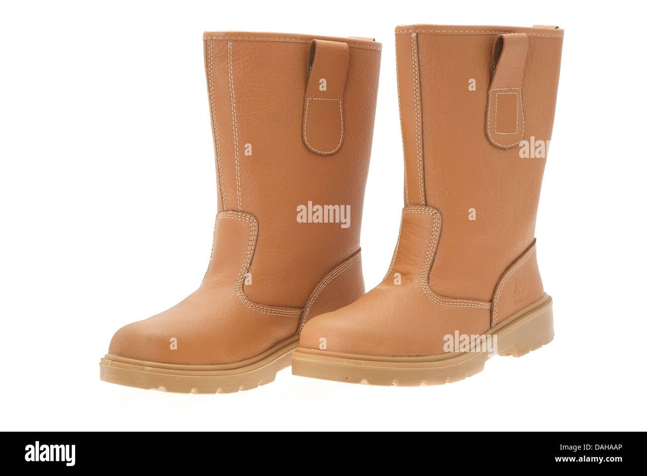 A pair of tan work boots that are worn by groundworks construction workers  Stock Photo - Alamy