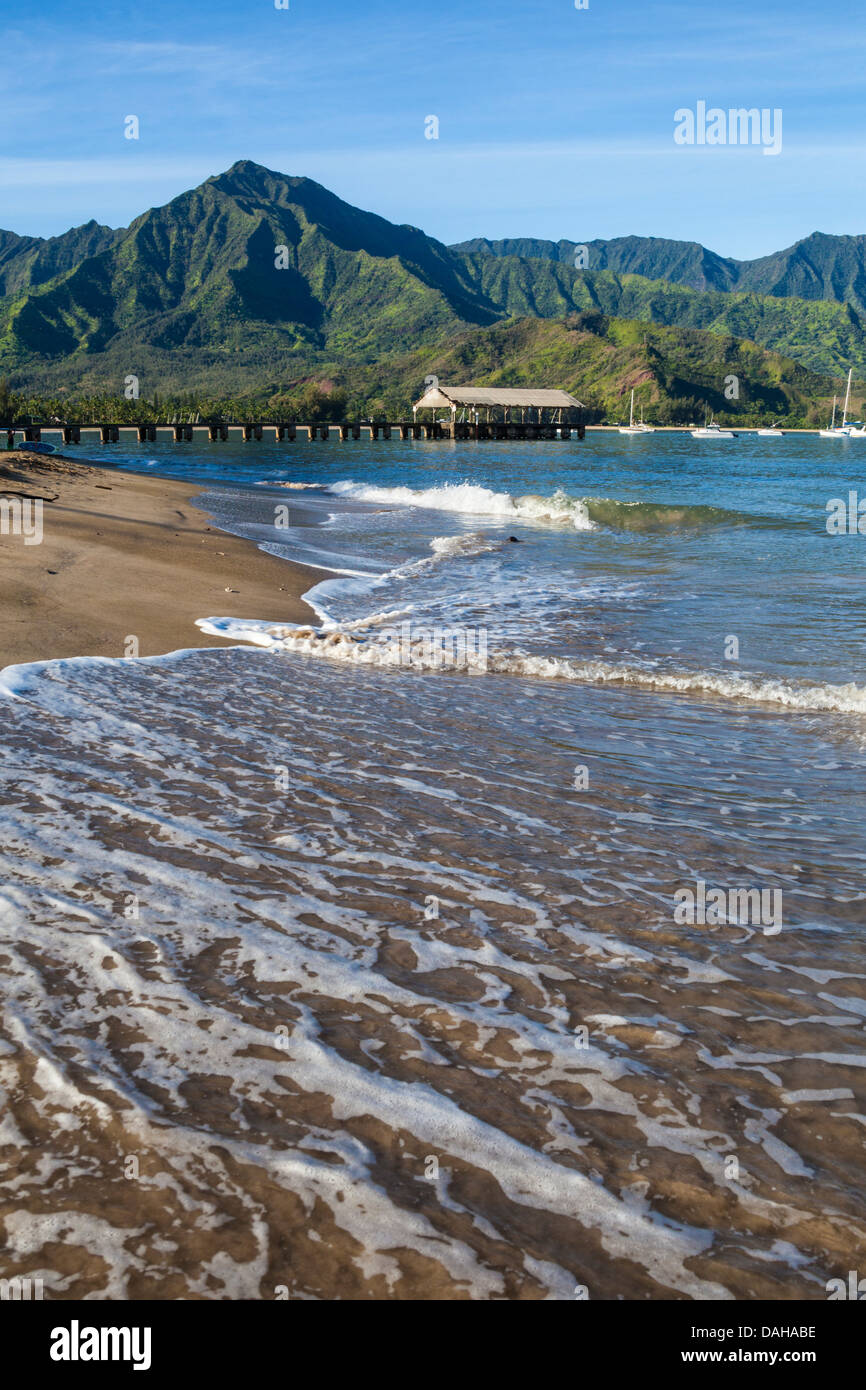 Hanalei Beach on Kauai, with the Hanalei Pier in distance Stock Photo