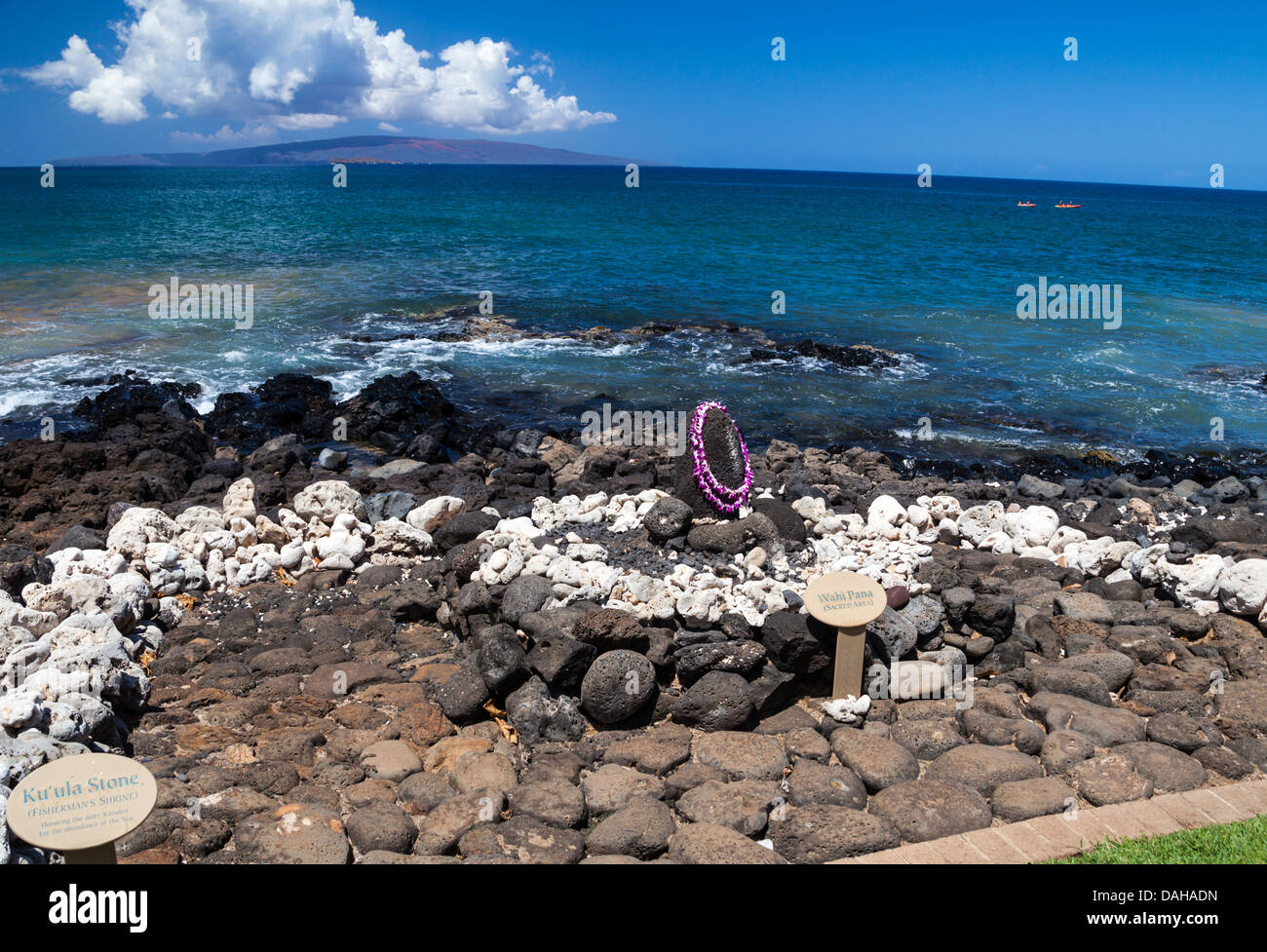 Cultural markers off the coastal walkway in Wailea, Maui point out the Ku'ula Stone, a fisherman's shrine Stock Photo