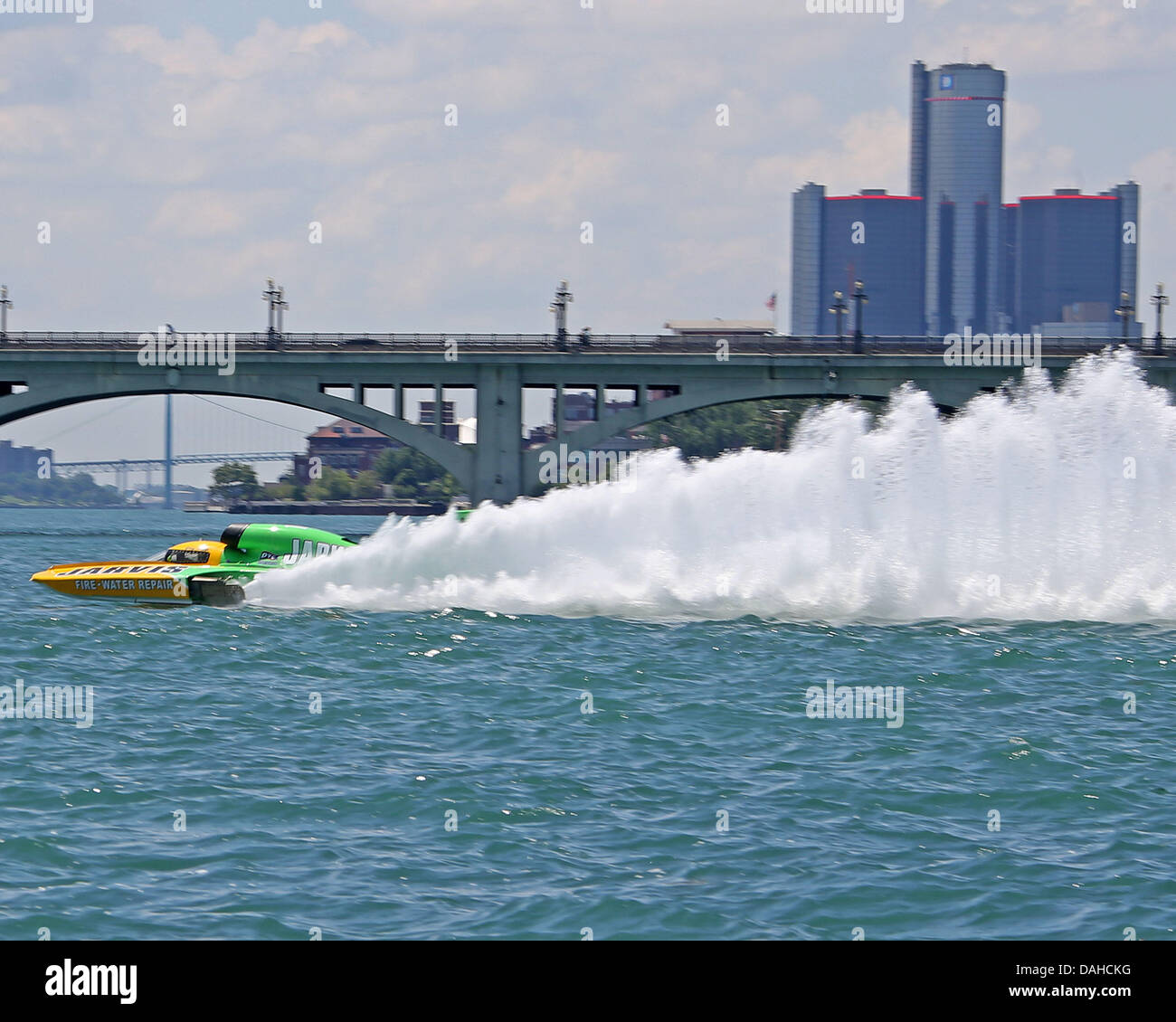 Detroit, MI, USA. 13th July, 2013. Greg Hopp (14) pilots his Jarvis Fire Water Repair boat past the Belle Isle bridge and the Detroit skyline during heat 1a on the Detroit River on July 13, 2013 in Detroit, Michigan. Tom Turrill/CSM/Alamy Live News Stock Photo