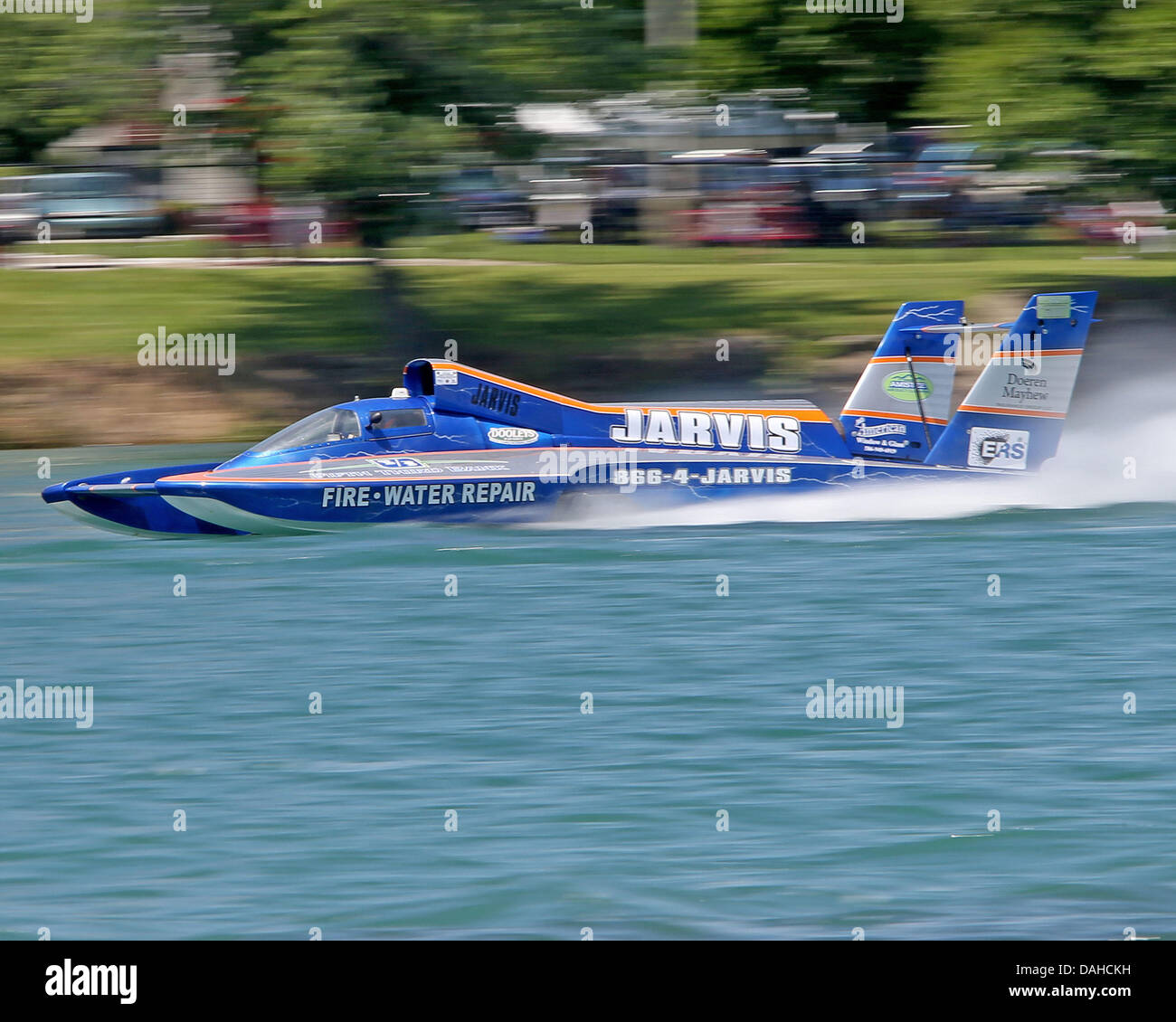 Detroit, MI, USA. 13th July, 2013. Ryan Mallow (100) pilots his Jarvis Property Restoration boat past the Detroit shoreline during heat 1b on the Detroit River on July 13, 2013 in Detroit, Michigan. Tom Turrill/CSM/Alamy Live News Stock Photo