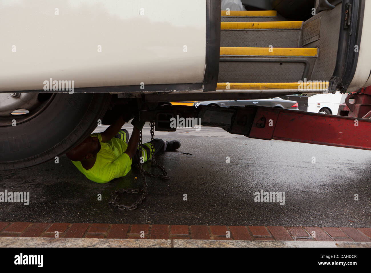 Mechanic working under a bus - USA Stock Photo