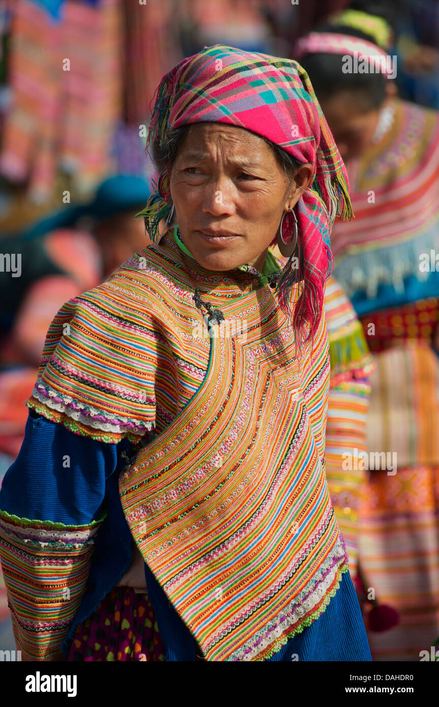 Hmong woman in tribal dress at Can Cau market, near Bac Ha. Lao Cai Province, Northern Vietnam Stock Photo