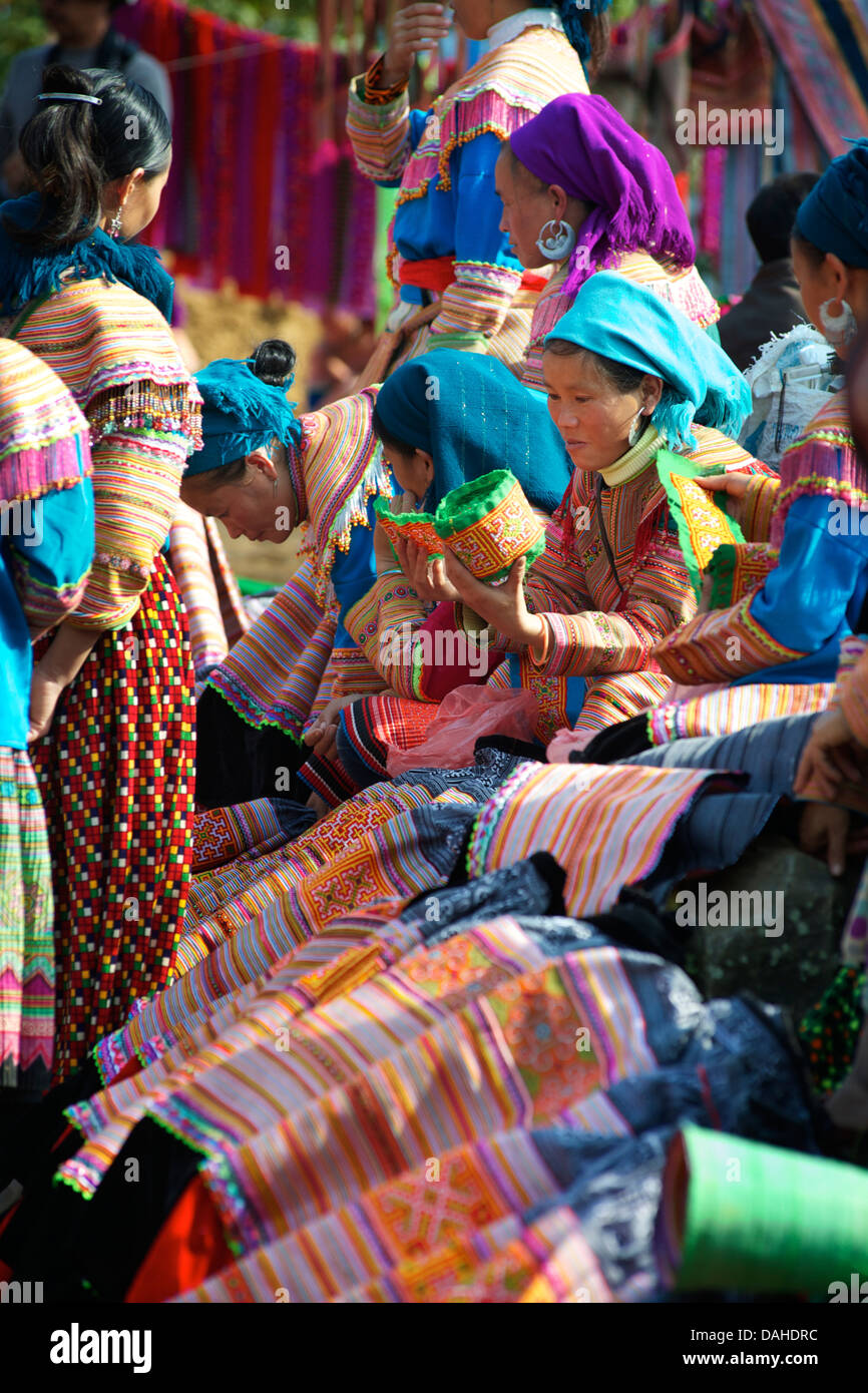 Flower Hmong skirt vendors at Can Cau market, near Bac Ha. Lao Cai Province, Northern Vietnam Stock Photo