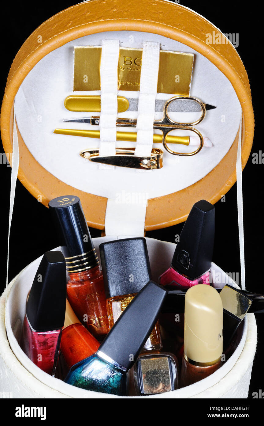 Manicure set and nail varnish in a round case. Stock Photo