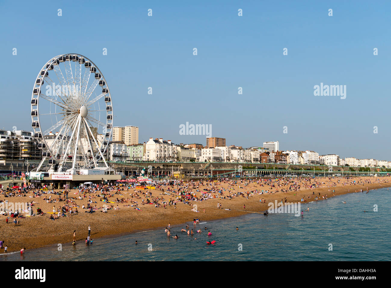 Brighton Wheel and coastline Brighton beach England Great Britain UK Stock Photo