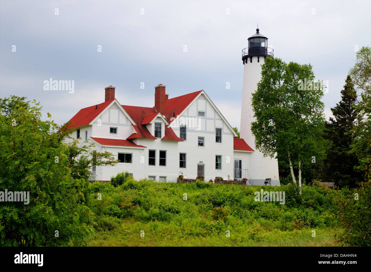 Point Iroquois Lighthouse has been standing guard over the treacherous Lake Superior shoreline for over a century  Hiawatha Nati Stock Photo