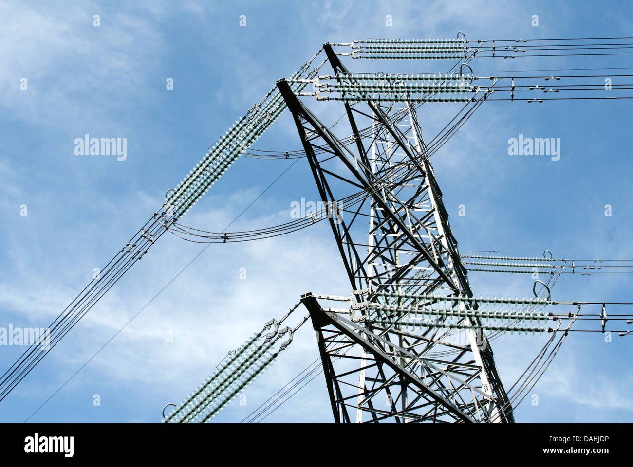 Close up of high voltage power lines and electric pylon Stock Photo - Alamy