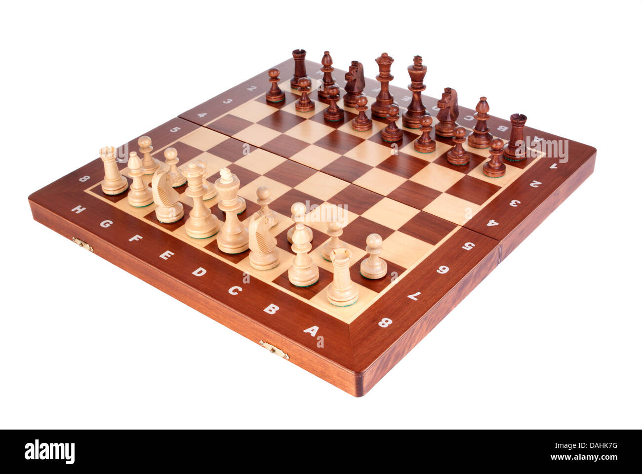 Wooden Chessboard with peaces ready to play on white background Stock Photo