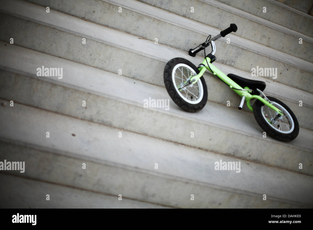 Small bicycle without pedals, on some stairs Stock Photo