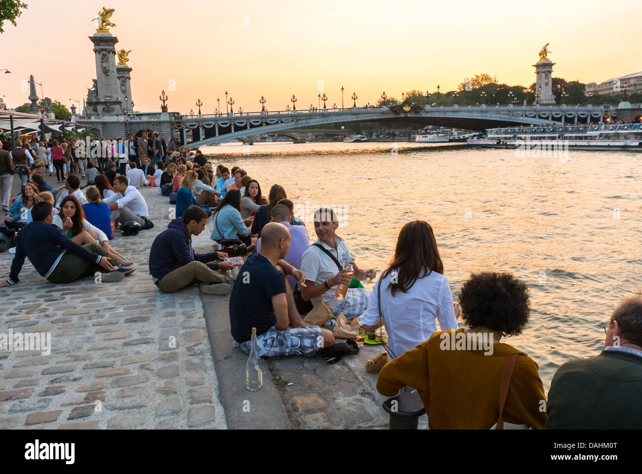 Paris, France, Large Crowd People, Tourists, Sharing Drinks on Seine River Quai, on Rive Droite, seine promenade green Stock Photo