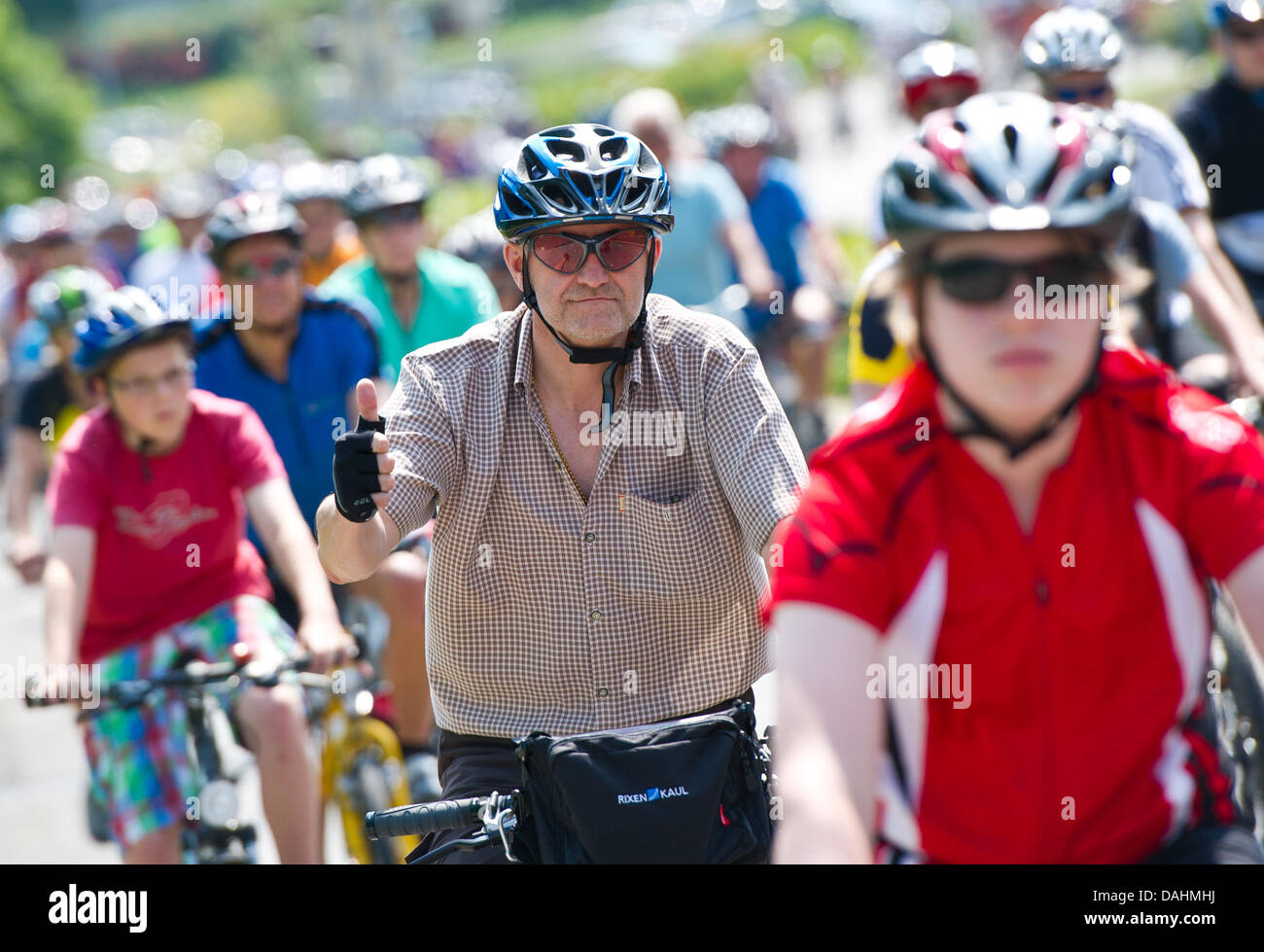 Participants cycle during the cycling rally (Fahrrad-Sternfahrt) through Stuttgart, Germany, 14 July 2013. Participants started in four different locations to cycle the between 13 and 28 kilometers to Stuttgart. Photo: DANIEL BOCKWOLDT Stock Photo
