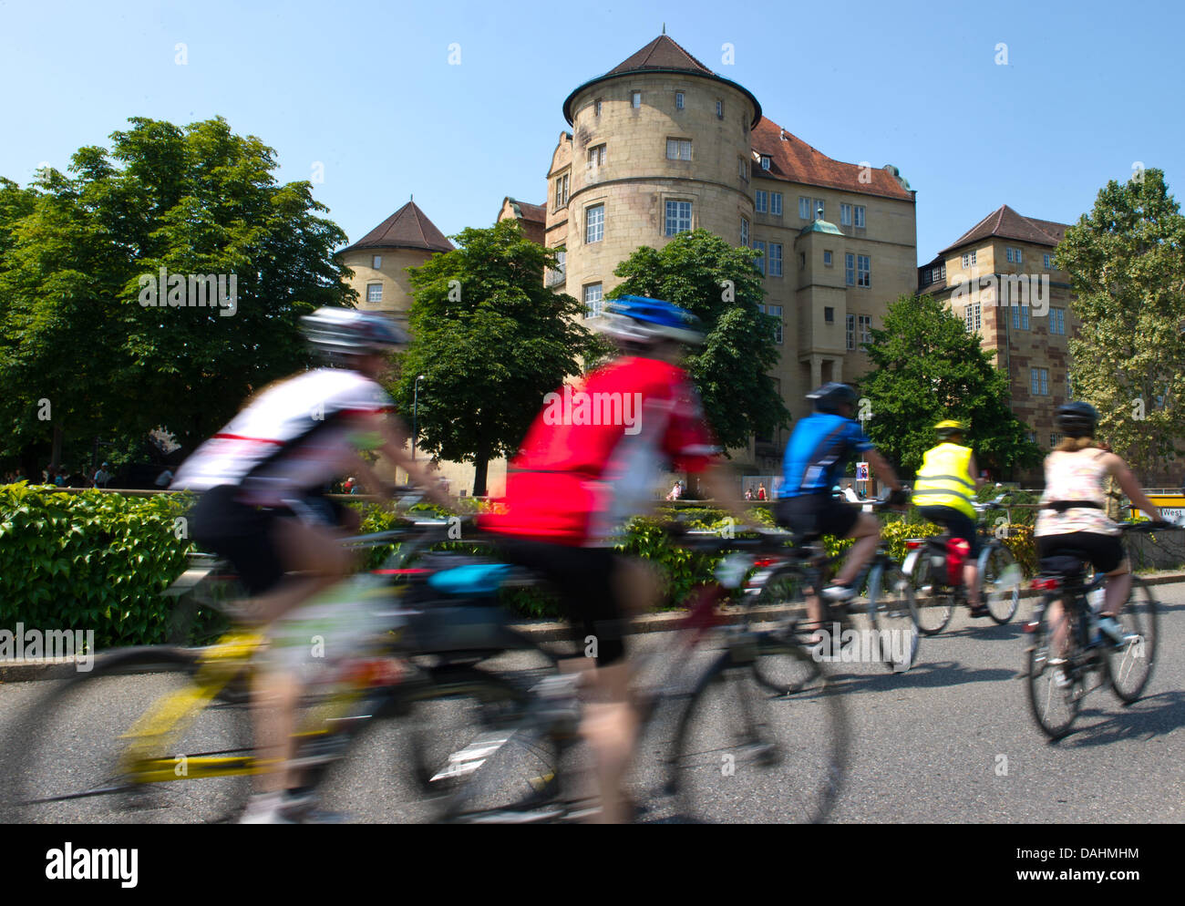 Participants cycle past the old castle during the cycling rally (Fahrrad-Sternfahrt) through Stuttgart, Germany, 14 July 2013. Participants started in four different locations to cycle the between 13 and 28 kilometers to Stuttgart. Photo: DANIEL BOCKWOLDT Stock Photo