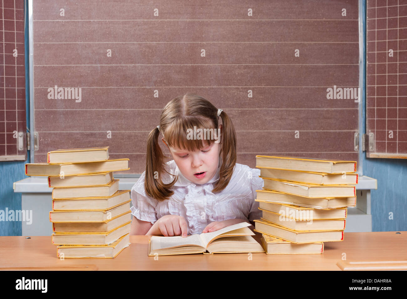 Schoolgirl in a classroom Stock Photo - Alamy