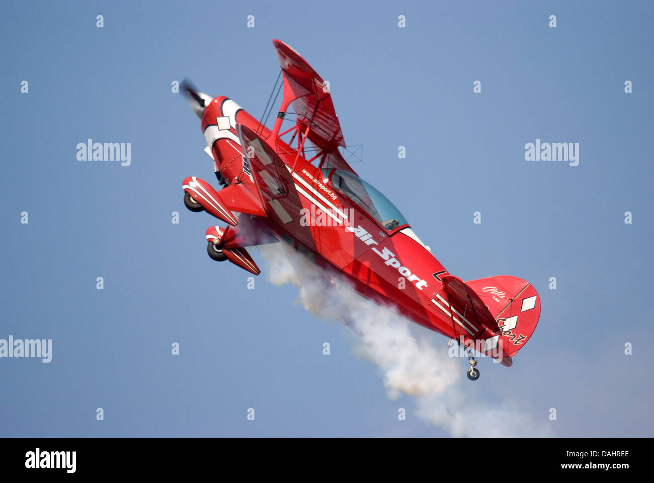 Red biplane flying in blue hi-res stock photography and images - Alamy