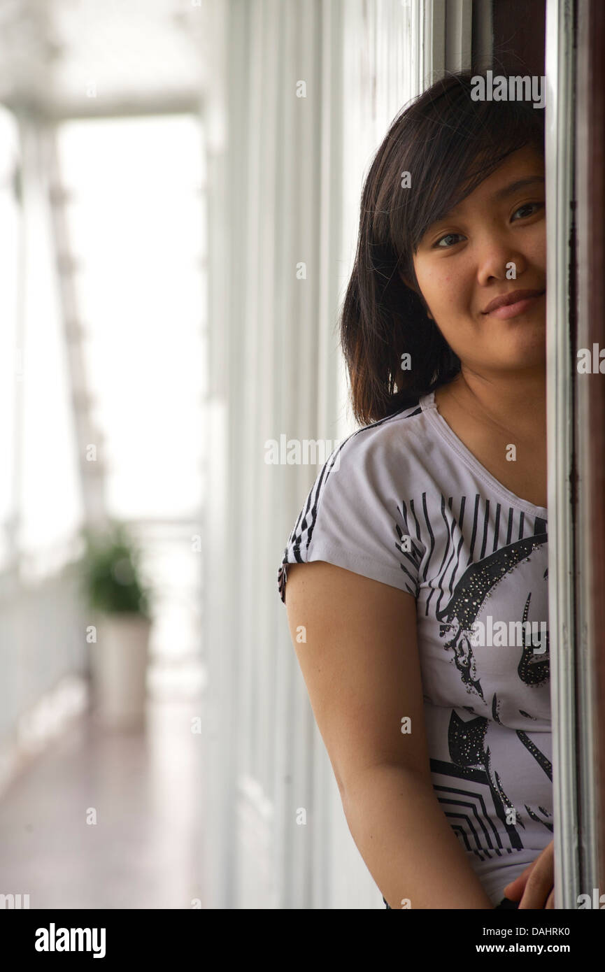 Vietnamese woman on a Ha Long Cruise boat, Vietnam Stock Photo