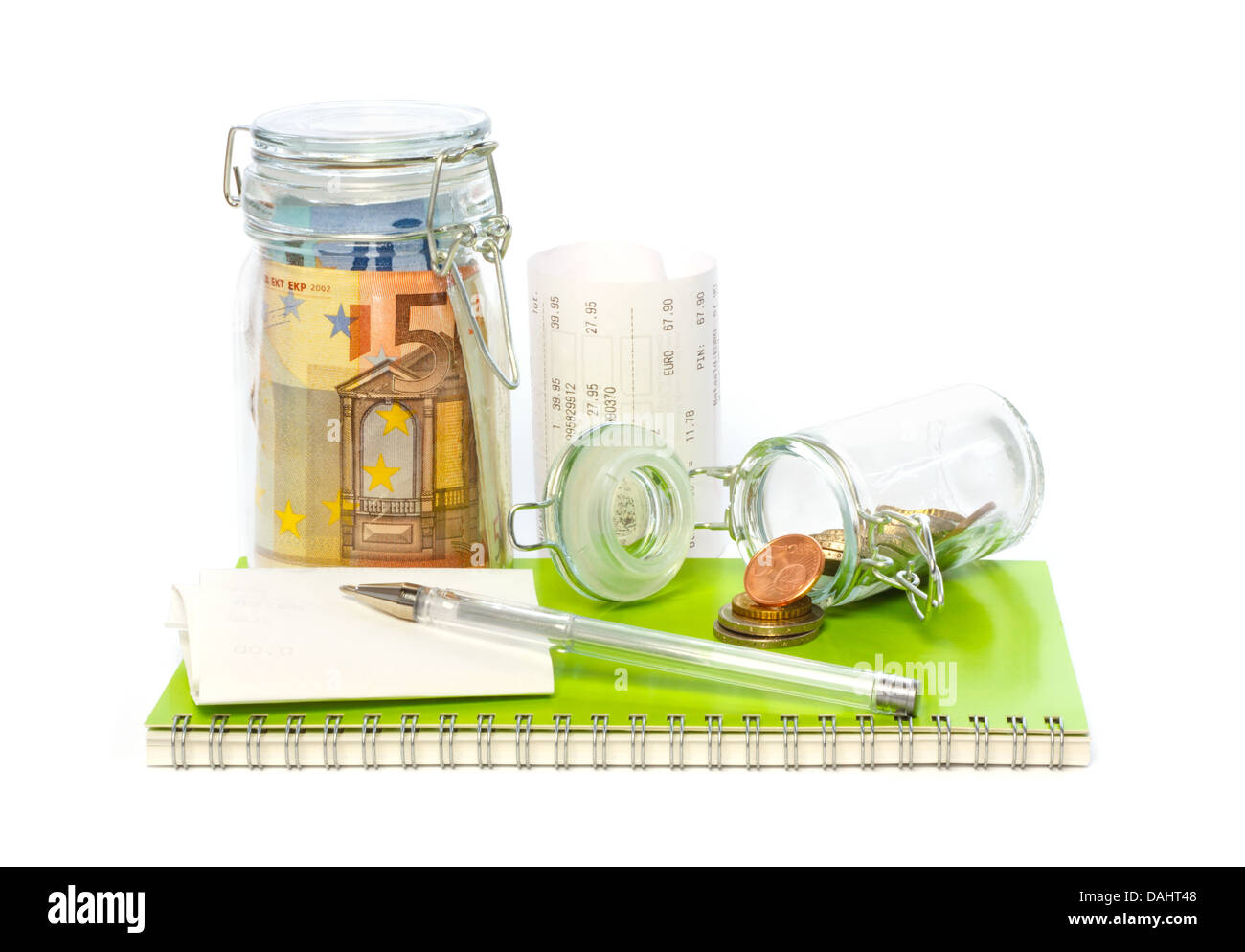 Euro savings on the expenditure book with cash register receipts and pen Stock Photo
