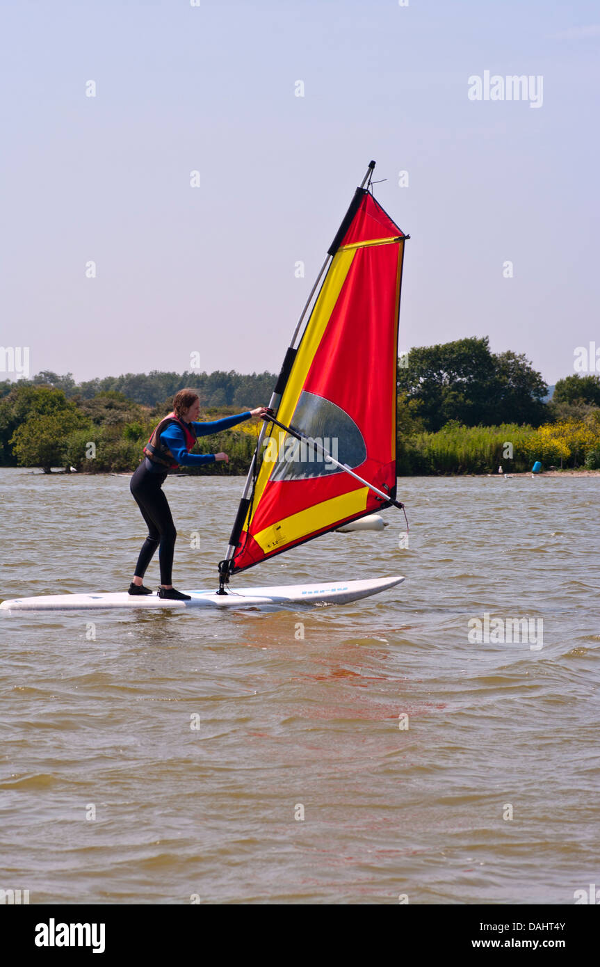 Teenage Girl learning To Windsurf UK Windsurfing Stock Photo