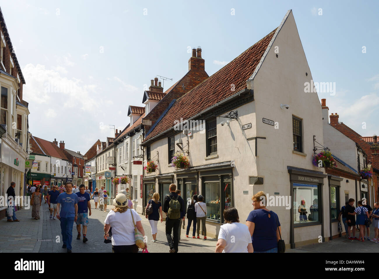Shoppers walking along Toll Gavel through Beverley town centre UK Stock