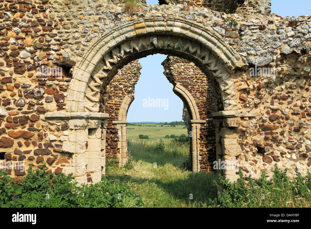 Bawsey, Norfolk, ruins of Norman church tower, arch with dog tooth decoration England UK English medieval ruined churches Stock Photo