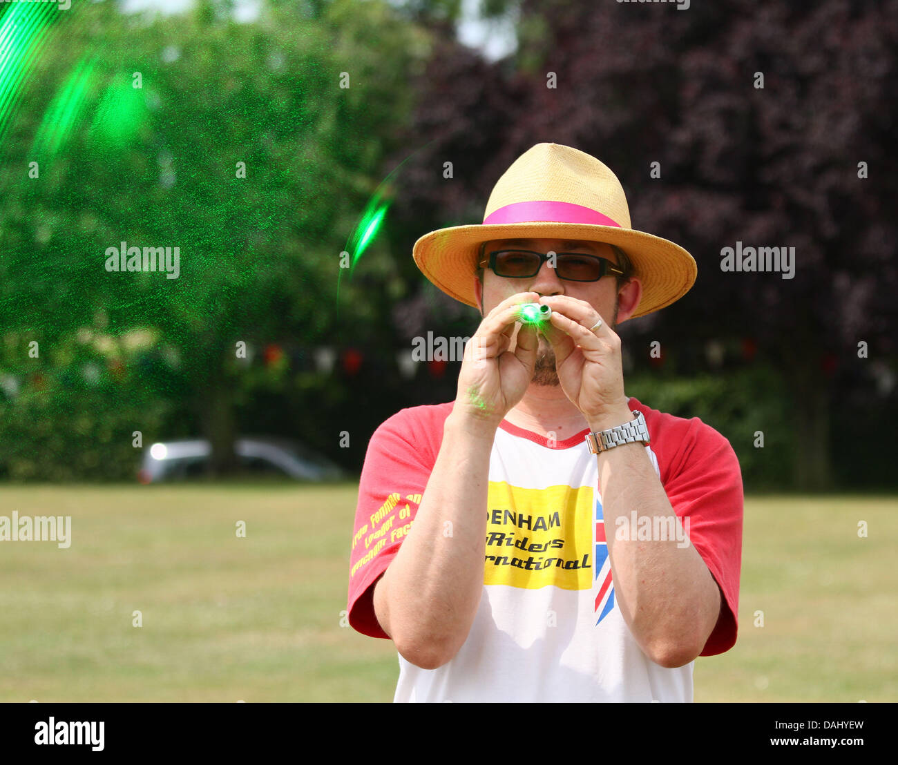 World Pea Shooting Championships . . 13.07.2013 Dan Cross competes in the competition. The World Pea Shooting Championships have been held annually at Witcham since 1971 and contestants may use peashooters made from any material, but must not exceed 12 inches in length. The peas must be fired by blowing with the mouth, and laser sights to help aim at the target, are not uncommon. Pic: Paul Marriott Stock Photo