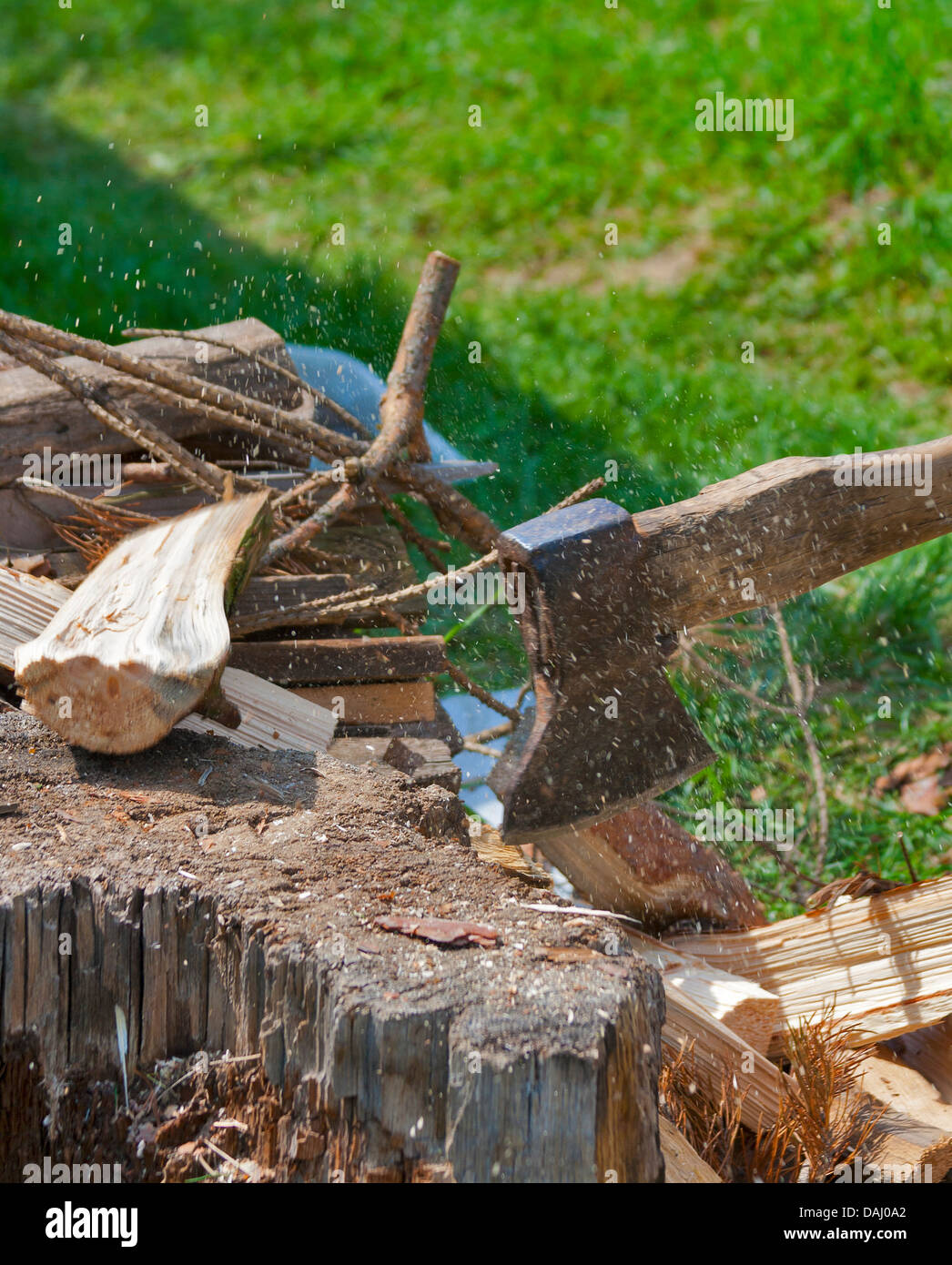 chopping wood with an old axe Stock Photo Alamy