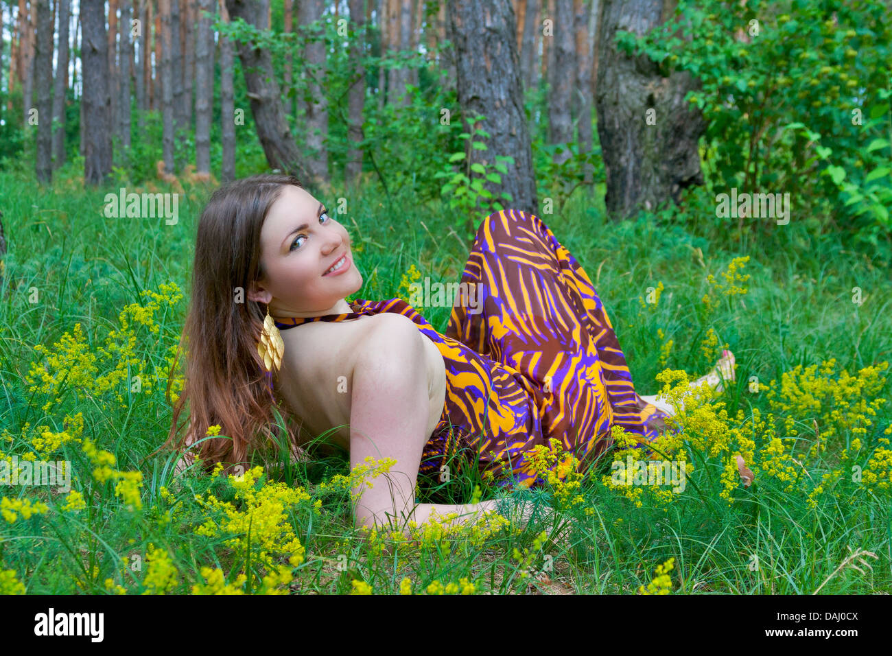 Young pretty green eyes woman lying in the summer forest Stock Photo ...