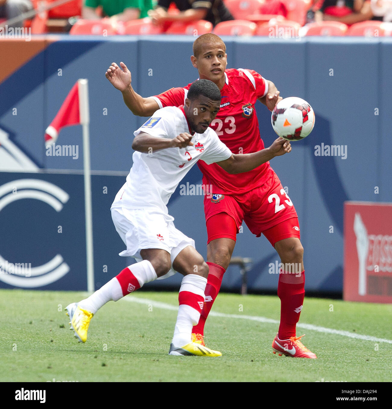 Commerce City, Colorado, USA. 14th July, 2013. MORGAN ASHTONE, left, of Canada battles for control of the ball with Panama's CHEN OBERTO, right, during the 2nd. half at Sports Autority Field at Mile High Sunday afternoon. Canada and Panama play to a 0-0 draw. Credit:  Hector Acevedo/ZUMAPRESS.com/Alamy Live News Stock Photo