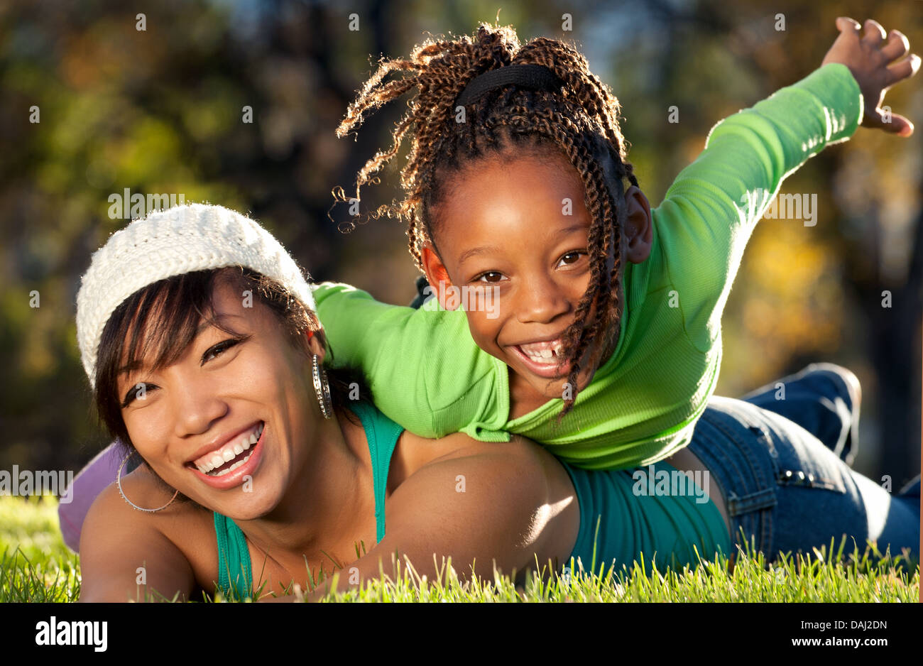 Happy mother and child having fun spending time together in a park Stock Photo