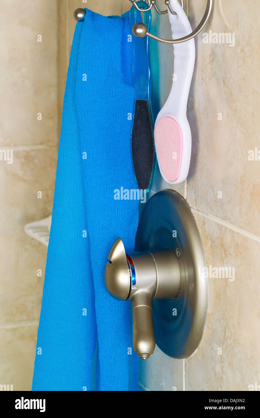 Vertical photo of shower accessories consisting of wash cloth